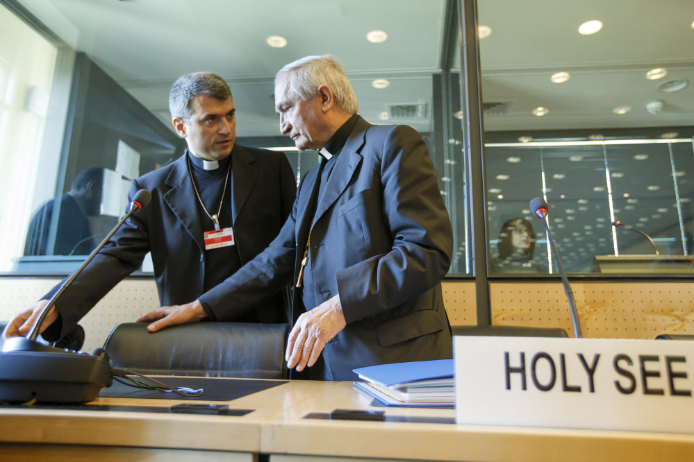 Archbishop Silvano M. Tomasi, right, Apostolic Nuncio, permanent observer of the Vatican to the Office of the United Nations in Geneva, speaks with Monsignor Christophe El-Kassis before the U.N. torture committee hearing on the Vatican, in Geneva, Switzerland, on Monday.
