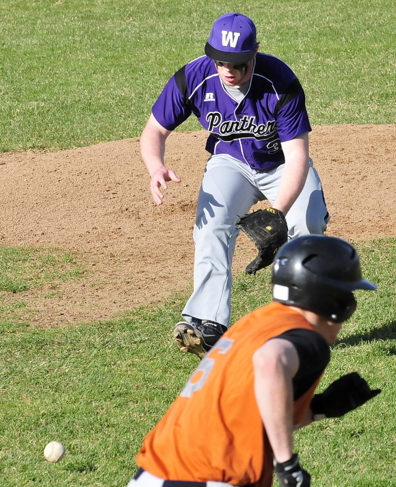 Staff photo by David Leaming Waterville pitcher Dan Pooler chases down the ball and throws to first for the out against Gardiner on Monday, May 5, 2014.