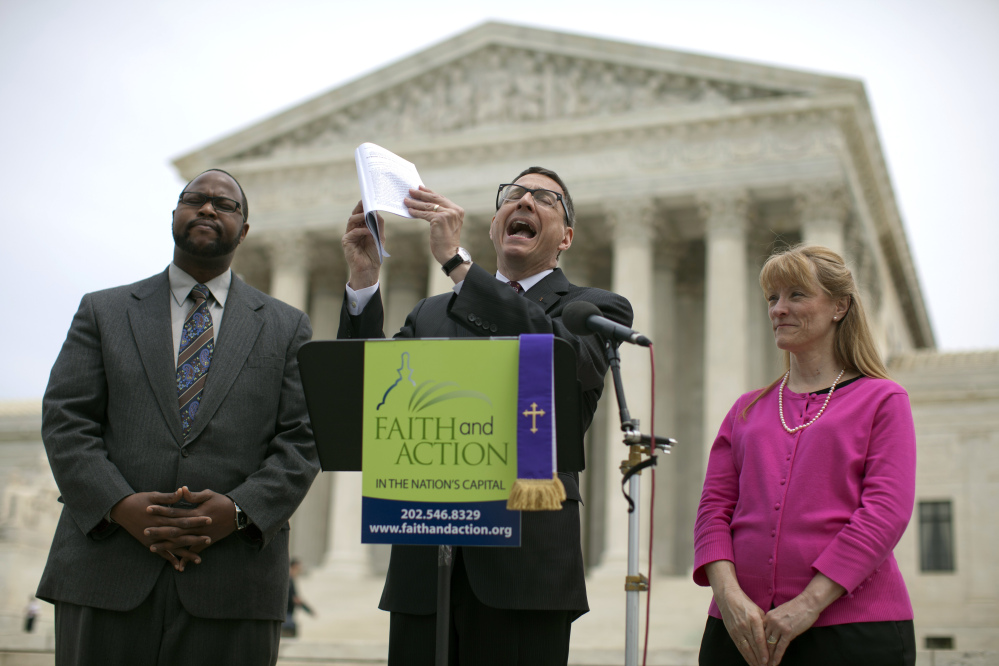 The Rev. Dr. Rob Schenck of Faith and Action, center, speaks in front of the U.S. Supreme Court with Raymond Moore, left, and Patty Bills, both also of Faith and Action, during a news conference Monday in Washington, in favor of the ruling by the court’s conservative majority that upheld decidedly Christian prayers at the start of local council meetings in a New York town.