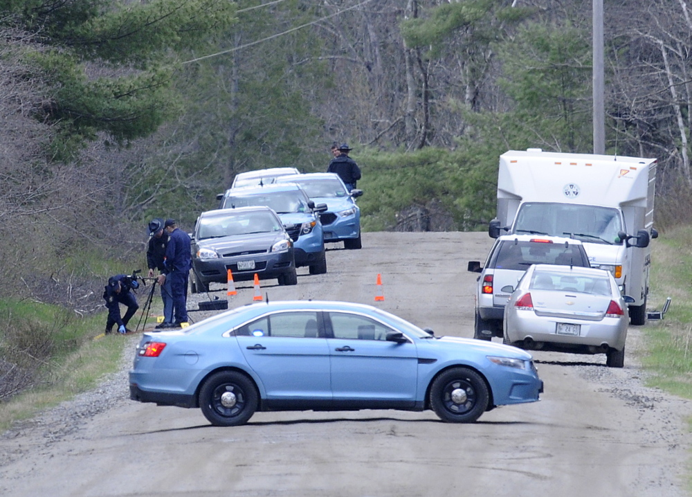Search: State Police search a site in Richmond on Monday while investigating the death of a Gardiner man whose remains were found at the site.