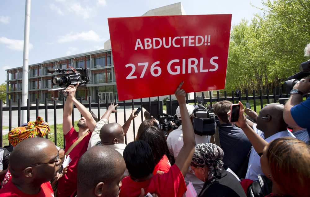 Demonstrators crowd the gate of the Nigerian embassy in Washington, D.C., Tuesday, protesting the kidnapping of nearly 300 schoolgirls, abducted from a school in a remote region of Nigeria three weeks ago.