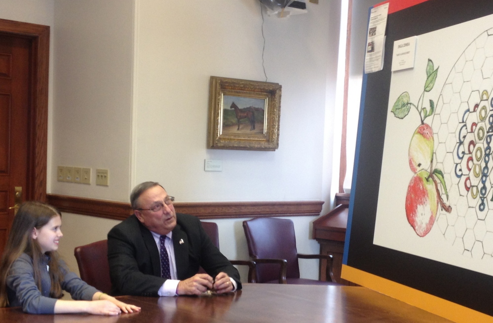 State Winner: Waterville fifth-grader Inga Zimba and Gov. Paul LePage discuss Inga’s winning state entry in the national Doodle4Google contest Tuesday at the State House.