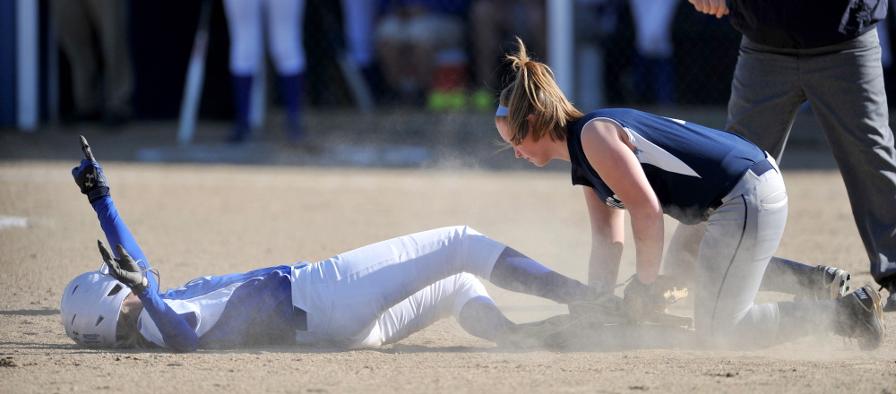 Staff photo by Michael G. Seamans Madison High School's Cristie Vicniere, 14, slides safely in to second base under the tag of Dirigo High School's Lauren Henderson, 5, right, in Madison on Wednesday. Madison defeated Dirigo 12-0 in six innings.