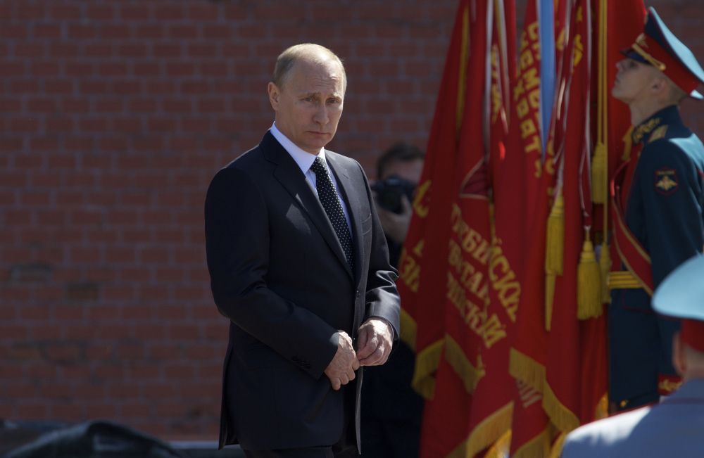 Russian President Vladimir Putin takes part in the wreath laying ceremony at the Tomb of the Unknown Soldier at the Kremlin wall in Moscow, Russia, Thursday. He also was present for a Russian nuclear forces exercise.