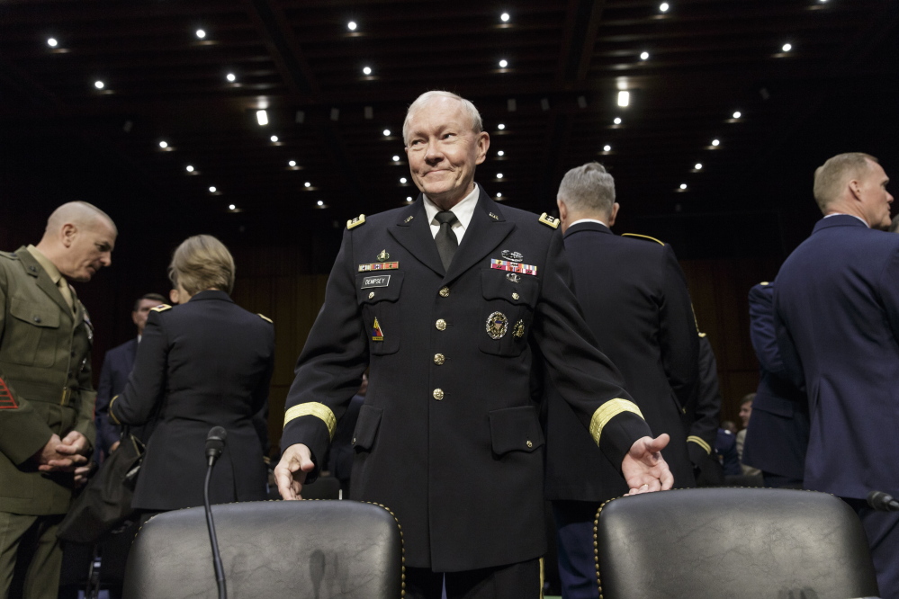 Chairman of the Joint Chiefs of Staff Gen. Martin E. Dempsey arrives to testify before the Senate Armed Services Committee about Department of Defense proposals on military pay and compensation, on Capitol Hill in Washington, Thursday.