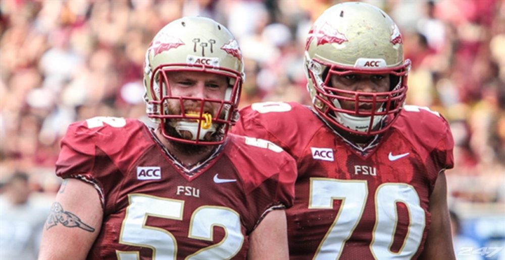Center Bryan Stork, left, was picked by the Patriots Saturday in the fourth round of the NFL draft.