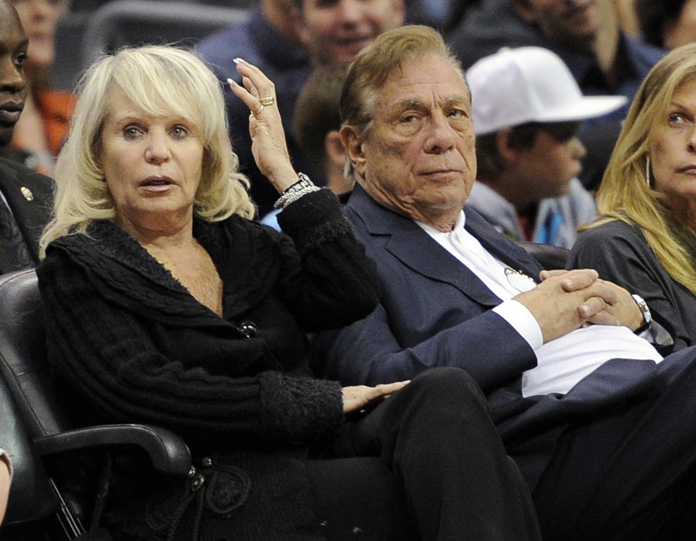Los Angeles Clippers owner Donald Sterling sits with his wife, Shelly, during a home game in 2010. An attorney representing Shelly Sterling says she will fight to retain her 50 percent ownership of the team.