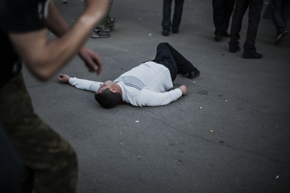 The body of a pro-Russia man lies on the ground in Krasnoarmeisk, Ukraine, Sunday.