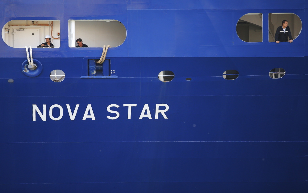David Boggs, a travel writer for Argo Global, photographs the Nova Star at Black Falcon terminal in Boston on Monday.