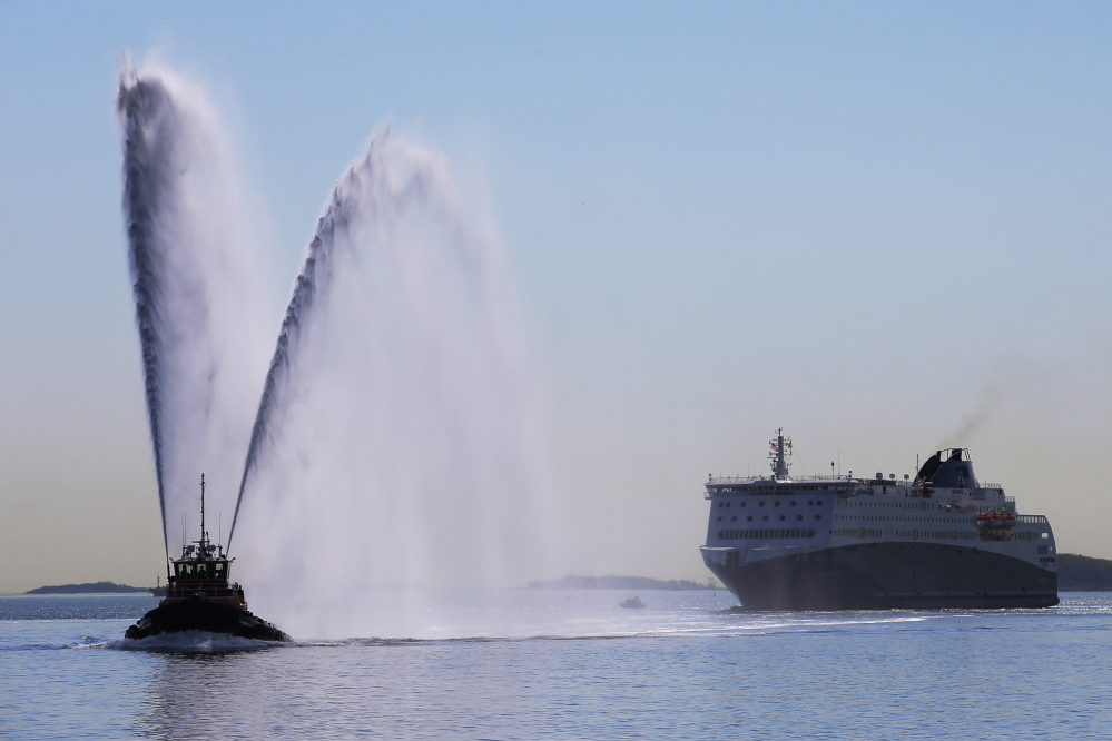 The Nova Star cruise ferry is escorted into port in Boston for a christening ceremony Monday.