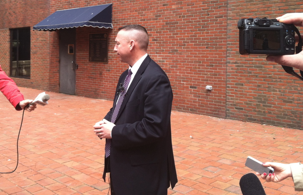 Portland Police Chief Michael Sauschuck responds to a media report about drug gang activity in Portland at a news conference Tuesday.