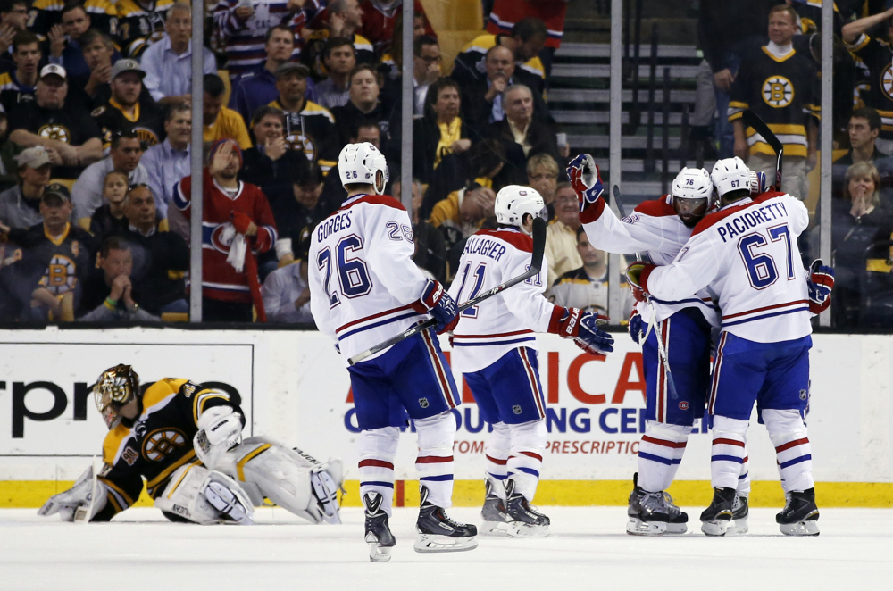 Montreal Canadiens left wing Max Pacioretty (67) celebrates his goal with defenseman P.K. Subban (76) and other teammates, against Boston Bruins goalie Tuukka Rask, left, in the second period of Game 7 of the second-round playoff series in Boston on Wednesday.