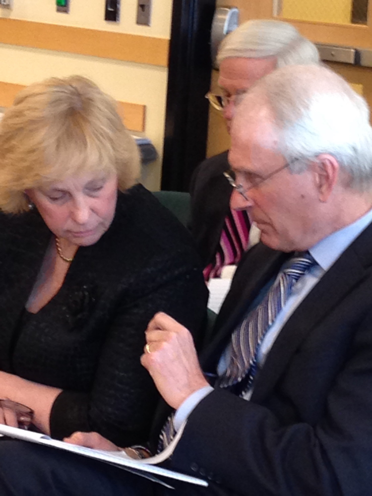 Sheila Pinette, director of the Maine Center for Disease Control and Prevention, consults with an attorney before her Government Oversight Committee testimony earlier this year.