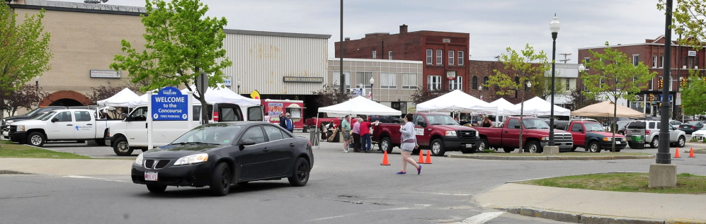 FOOD FOR THOUGHT: Vendors set up every Thursday in The Concourse for the Downtown Waterville Farmers’ Market.