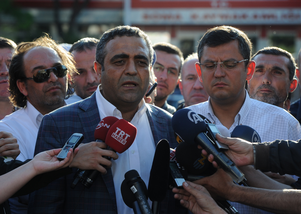 Opposition lawmakers Sezgin Tanrikulu, left, and Ozgur Ozel, right, speak to the media outside a local courthouse in the coal miners’ town of Soma, Turkey, Sunday.