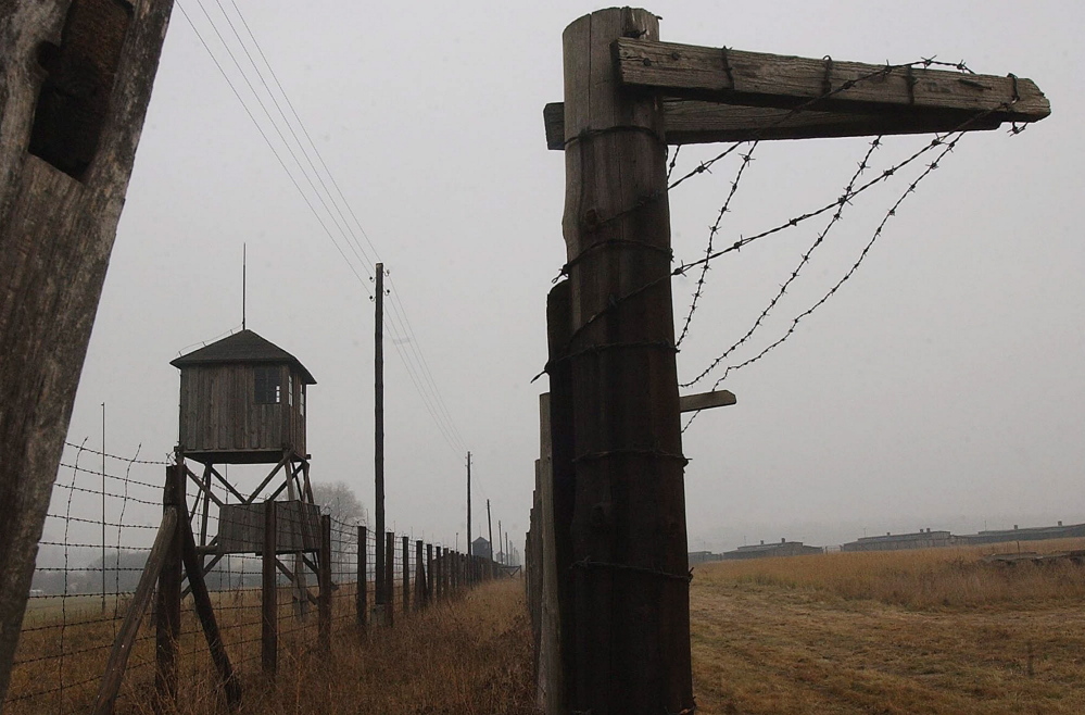 In this November 2005 file picture watch towers and a barbed wire fence of the former Nazi death camp Majdanek outside the city of Lublin in eastern Poland. The head of Germany’s special prosecutors’ office that investigates Nazi war crimes says the first phase of a probe of hundreds of former Majdanek death camp guards is nearly complete. Federal prosecutor Kurt Schrimm told reporters Tuesday May 20, 2014 his office was preparing to recommend within the next two weeks that state prosecutors pursue charges against multiple suspects.