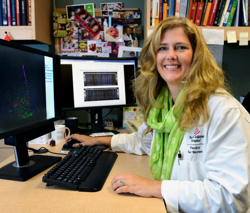 Dr. Kjersti Aagaard works at the Baylor College of Medicine in Houston on Monday. Her research shows a small community of bacteria lives in the placentas of healthy pregnant women.