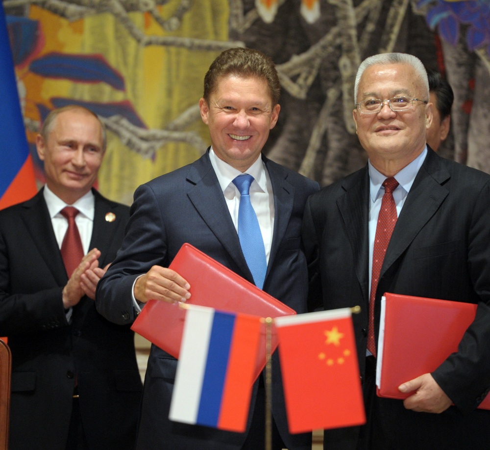 Russia’s President Vladimir Putin, left, applauds during a signing ceremony in Shanghai, China, on Wednesday, while Russian Gazprom CEO Alexei Miller, second left, and China’s CNPC head Zhou Jiping hold documents.