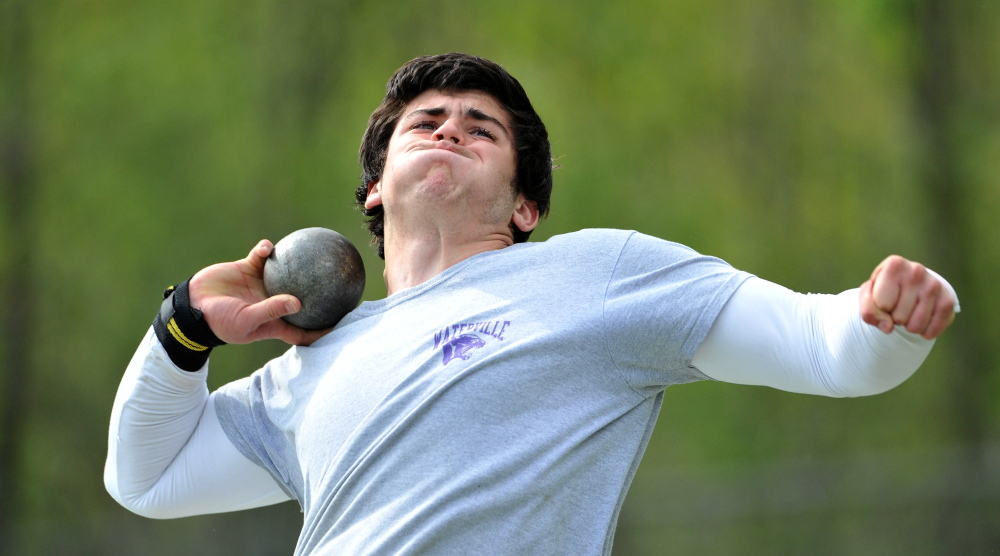 Staff photo by Michael G. Seamans Waterville Senior High School's Trever Gray competes in the shot put at the annual Community Cup track meet at Lawrence High School in Fairfield on Thursday, May 22, 2014.