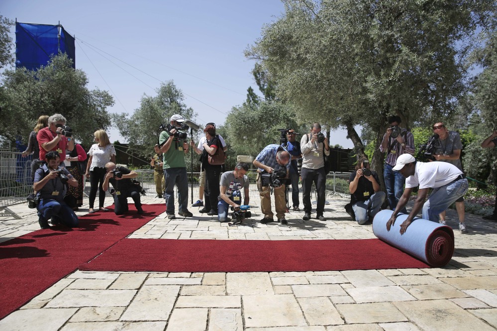 A red carpet is unrolled at the Israeli president’s residence in preparation for the Papal visit to Jerusalem.