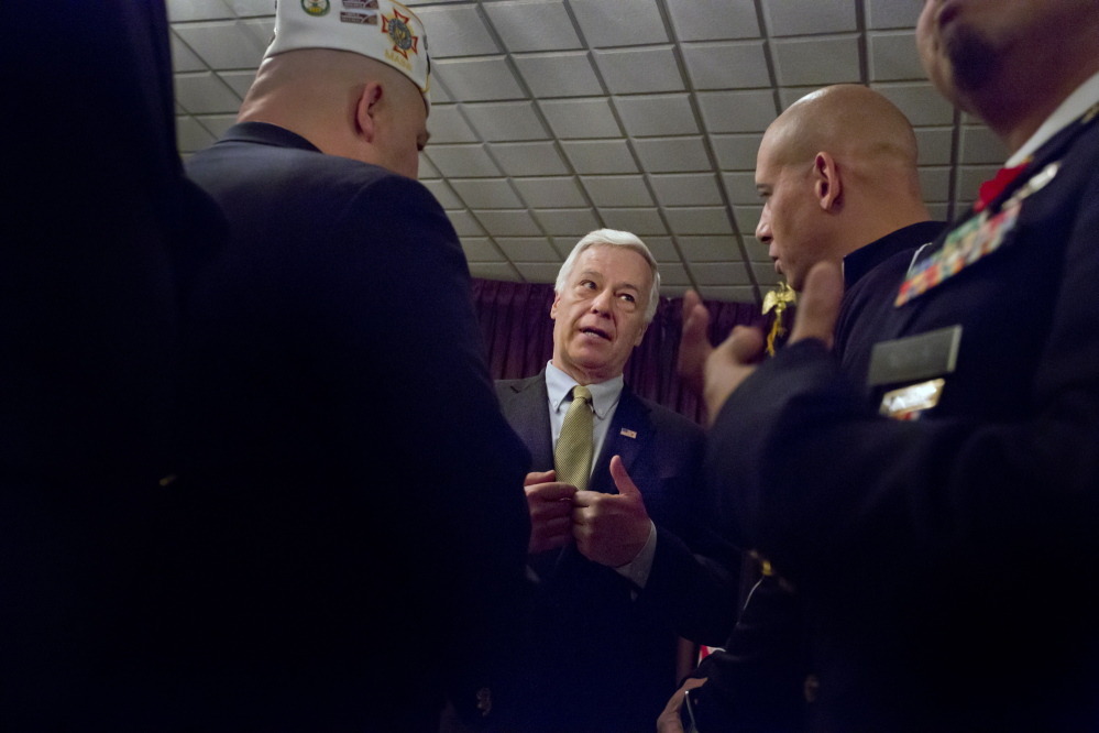 At VFW Deering Memorial Post 6859 in Portland on Friday, Democratic U.S. Rep Mike Michaud, seen with post Commander Steven San Pedro, left, and David Price, called for reform of the Department of Veterans Affairs. His opponents, Gov. Paul LePage and independent Eliot Cutler, said Congress has long ignored problems at the VA.