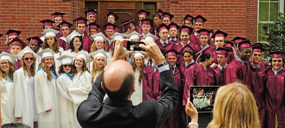 MEMENTOS: Parents take photos of graduates on the steps of Bearce Hall before the graduation ceremony Saturday at Kents Hill School in Readfield.