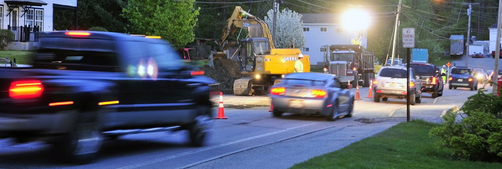 Night Work: Flaggers alternate the direction of traffic flow in one lane through an overnight construction zone Wednesday on Mount Vernon Avenue in Augusta.