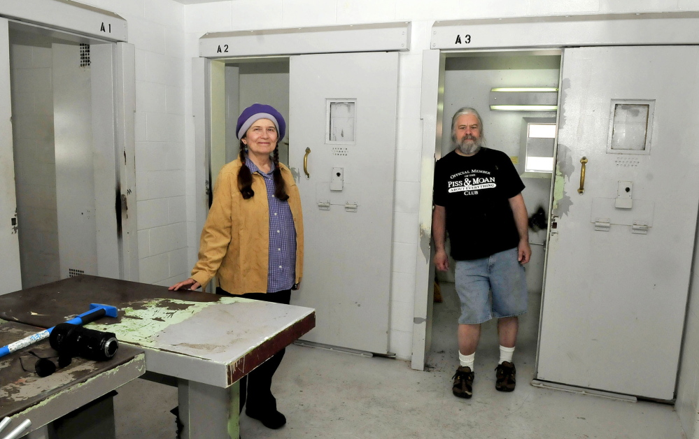 MUSICAL CELL: Annie Stillwater Gray, of the Wesserunsett Arts Council, and program engineer Timothy Smith, shown Thursday, discuss plans to convert cellblock E13 at the former Somerset County Jail in Skowhegan into a noncommercial and community-based radio station: 98.1.