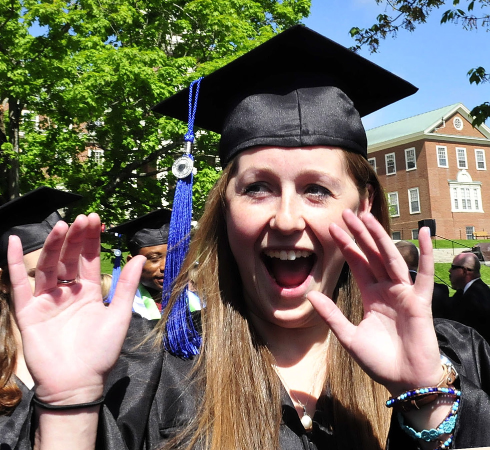 YEAH: Colby College graduate Amelia Barnett calls out to family members during the procession for the 193rd commencement exercise at the Waterville college on Sunday.
