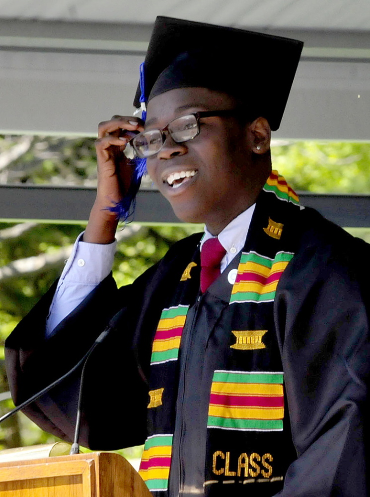 THANKS FOR THE MEMORIES: Colby College Senior Class Speaker Omari Matthew brushes the tassel from his face while speaking personally to the graduating class during the 193rd commencement at the Waterville college on Sunday.