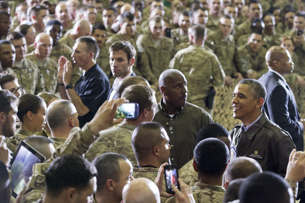 President Obama greets troops at Bagram Air Field, north of Kabul, Afghanistan, during an unannounced visit on Sunday.