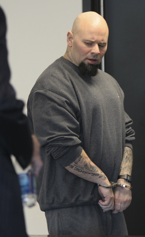 Jared Remy walks into court Tuesday in Woburn, Mass. Admitting he killed his girlfriend, he asked the public to “blame me for this, and not my family.”