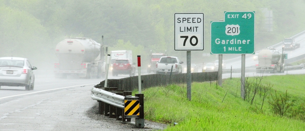 NEW SPEED: Cars on Interstate 295 head south past a sign showing newly raised speed limit on Tuesday May 27, 2014 in Gardiner.
