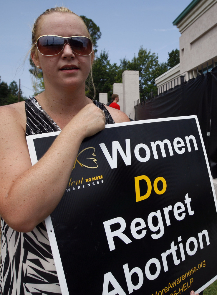 Ashley Sigrest of Brandon, Miss., protests abortion in 2012. New laws on hospital admitting may limit access to the procedure.