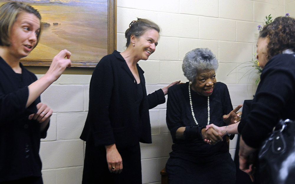 ANGELOU VISIT: Maya Angelou, second from right, greets Brenda Schertz, right, Marissa Zastrow, left, and Margaret Haberman, second from left, before Angelou’s presentation April 26, 2010 in Augusta. The University of Maine at Augusta sponsored the poet’s visit.