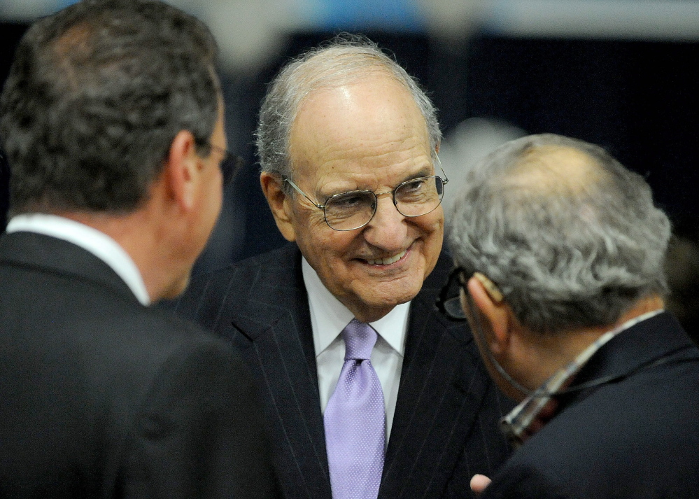 BACK IN TOWN: Former U.S. Sen. George Mitchell talks with people gathered at the Boys and Girls Club 90th anniversary celebration at the Alfond Youth Center in Waterville on Friday.