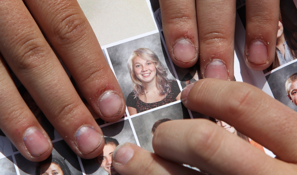 Wasatch sophomore Rachel Russell, 16, points to her altered school yearbook photo. “I was pretty angry about it, really, because that’s who we are,” said Russell, who had sleeves added to her picture.