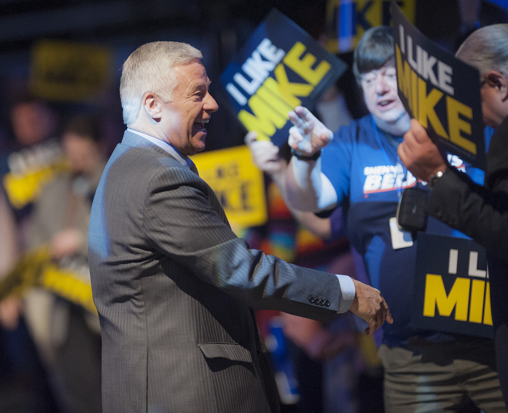 U.S. Rep. Mike Michaud, a candidate for governor in Maine, is greeted at the Maine Democratic Convention in Bangor on Saturday.