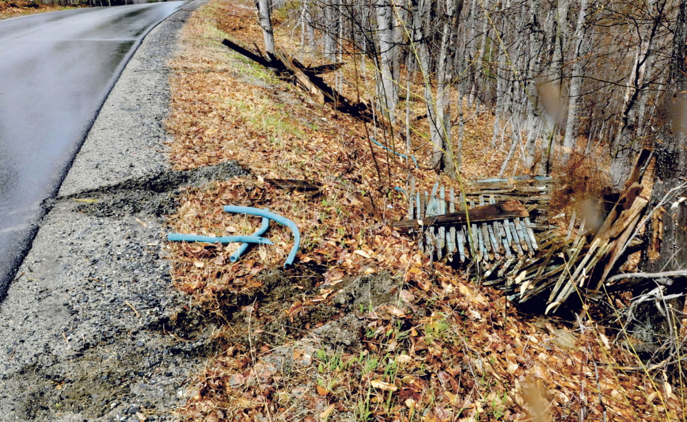 DRIVE-BY LITTERING: Tire tracks remain in the shoulder of Penney Road in Belgrade after someone apparently backed up and dumped piles of debris there recently.