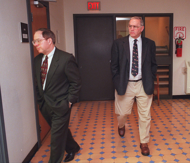 In this 1997 file photo Jack DeCoster, right, follows his attorney Bill Smith to the courtroom in the Wright County Court house to testify in defense of his family's hog confinement facilities in Clarion, Iowa.