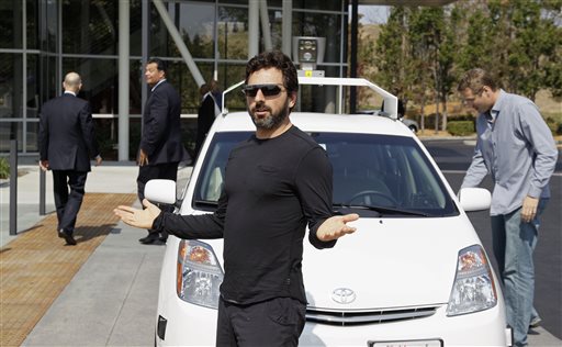 Google co-founder Sergey Brin talks about riding in a driverless car in this 2012 photo.