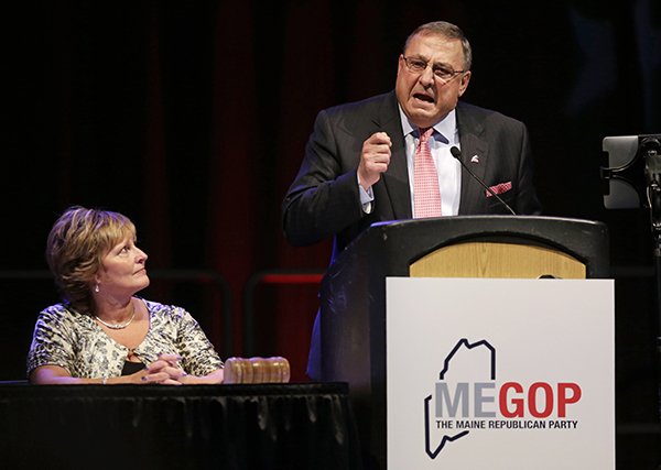 Gov. Paul LePage speaks at the Maine Republican Convention in 2014, while his wife, Ann, looks on.