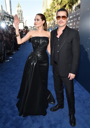 Angelina Jolie and Brad Pitt arrive at the world premiere of "Maleficent" in Los Angeles on Wednesday.