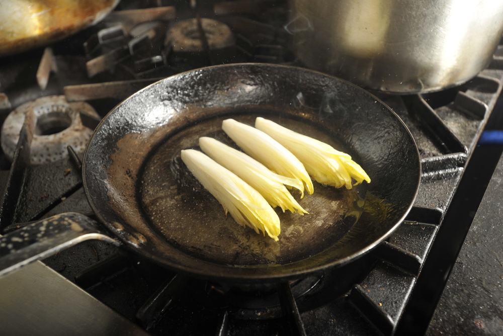 The endive is sautéed on the stove top, then finished in the oven.