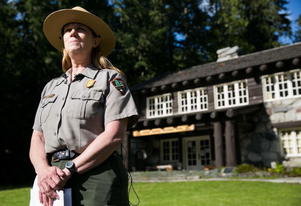 Mount Rainier National Park spokeswoman Patti Wold briefs reporters in Ashford, Wash., on Saturday about search and rescue efforts for six missing climbers on Mount Rainier.
