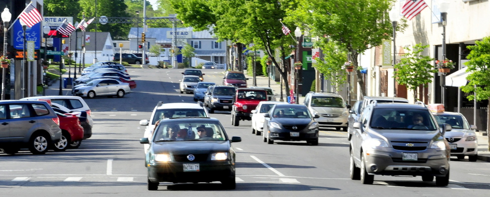 TRAFFIC: Traffic moves through downtown Waterville on the one-way Main Street on Sunday. City officials are exploring ideas to return Main and Front streets to two-way traffic to ease congestion, slow traffic down and encourage shoppers to patronize downtown businesses.