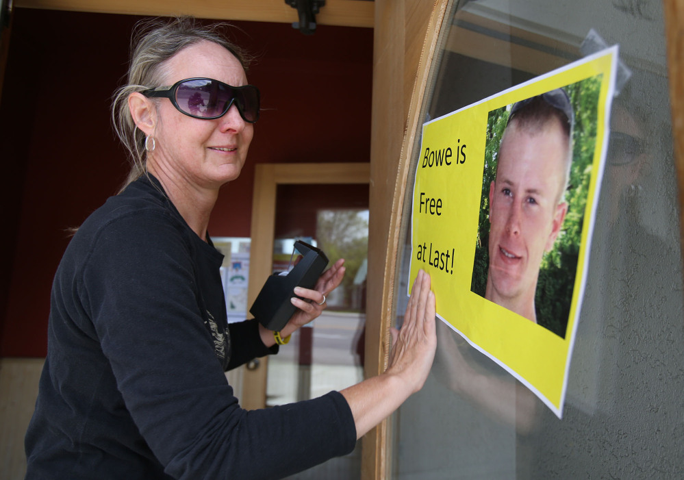 Sondra Van Ert, co-owner of Baldy Sports, hangs a sign celebrating news of Army Sgt. Bowe Bergdahl’s release Saturday in Hailey, Idaho, his hometown. Bergdahl, 28, had been held prisoner by the Taliban since June 30, 2009.