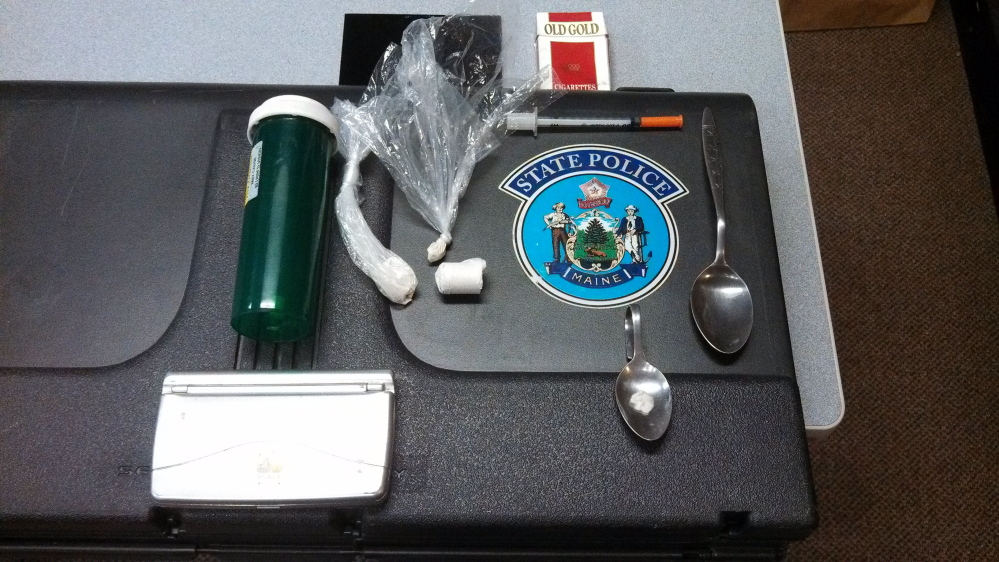 Evidence: Drug paraphernalia in plain view in a motor vehicle led to the discovery of heroin with an estimated street value of $5,000.