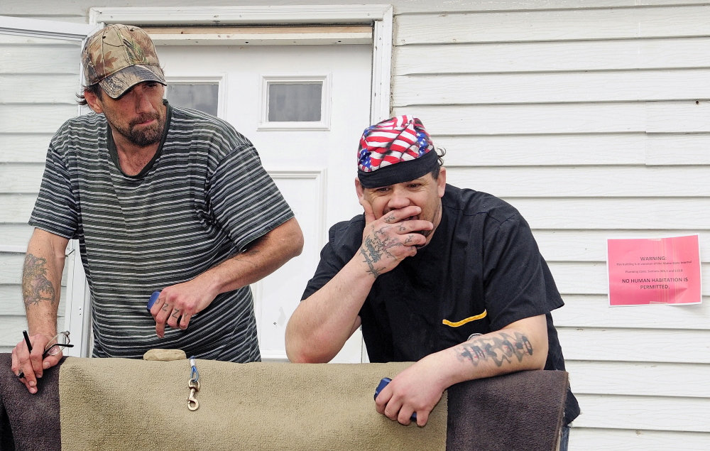 FIXING UP: Tyson Joseph Goldstein, left, and Brett Hollowell Sr., say they plan to stay at Meadowbrook Trailer Park now that improvements are in the works.