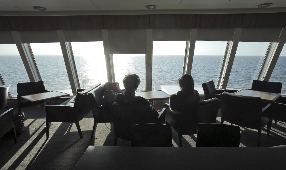 Passengers enjoy the view from above the bow inside the forward lounge shortly before the Nova Star ferry arrives at Yarmouth, Nova Scotia, on its maiden voyage from Portland on May 16. The ferry company expects 100,000 customers this season, which runs until Nov. 1.